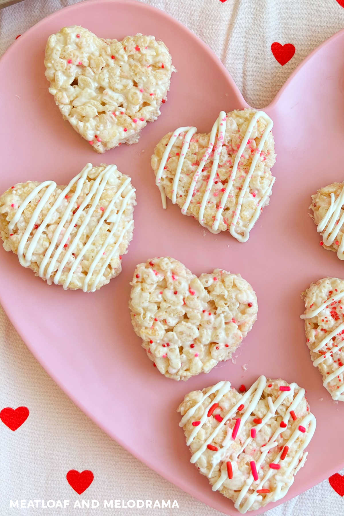 heart shaped Valentine Rice Krispie Treats for Valentine's Day on a pink heart plate