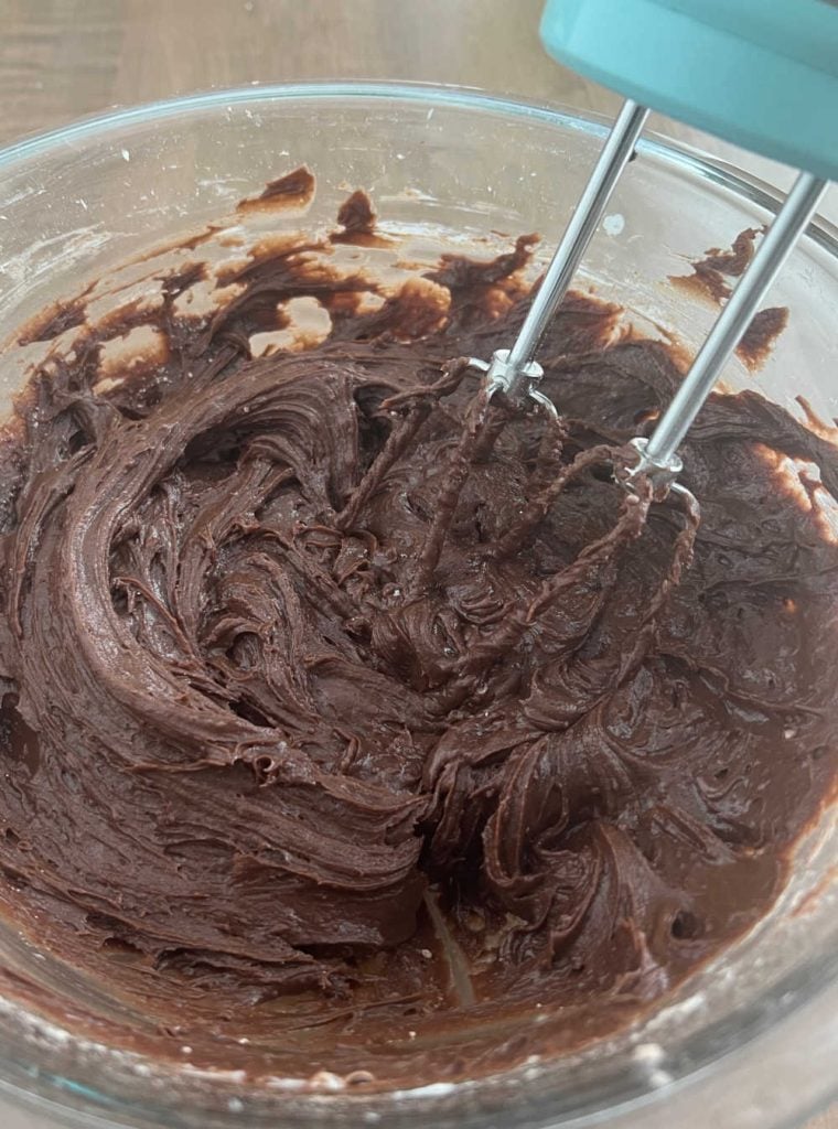 mix cream cheese and brownie mix with electric mixer