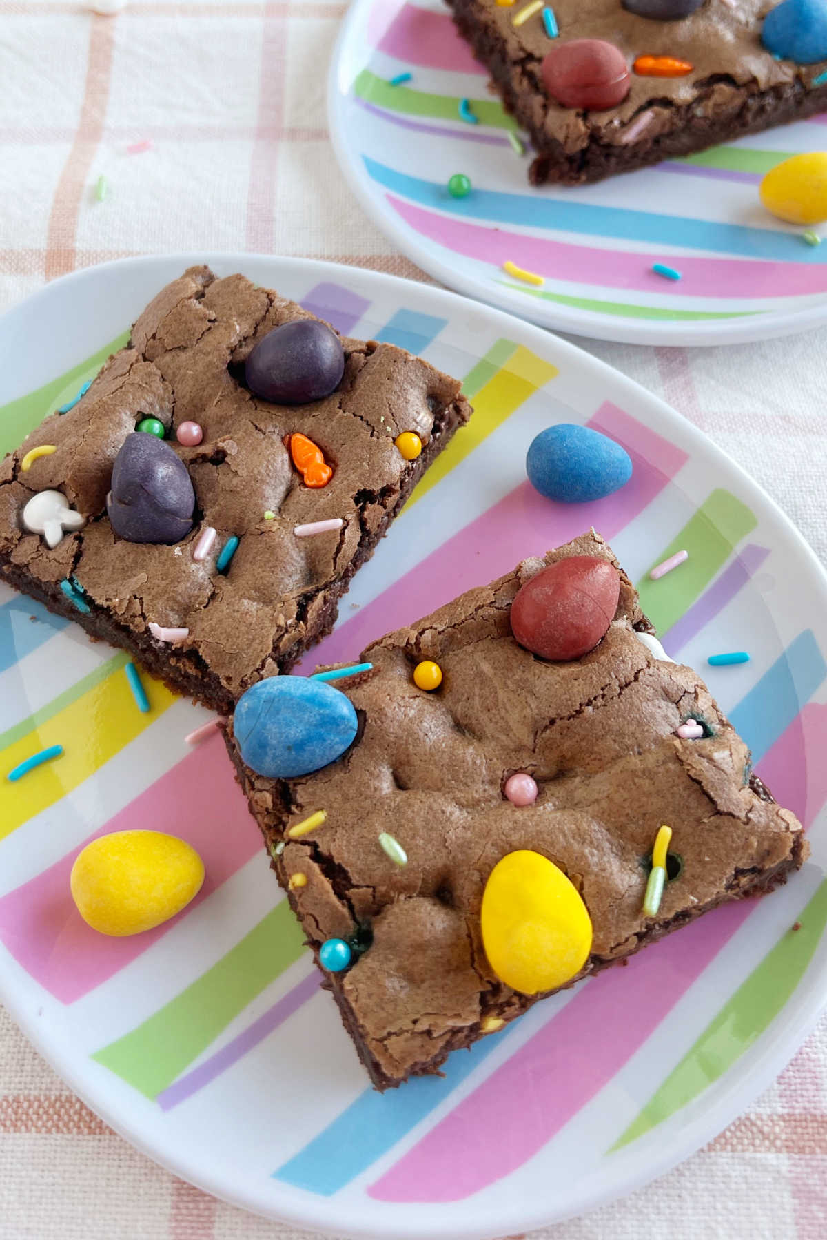 Easter brownies with mini eggs on Easter egg shaped plates