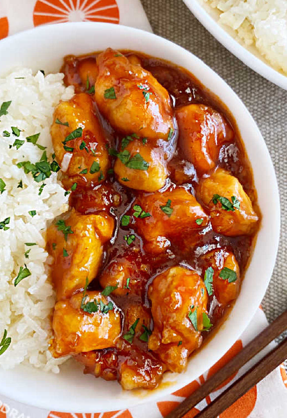 closeup of orange chicken in 3 ingredient sauce with jasmine rice