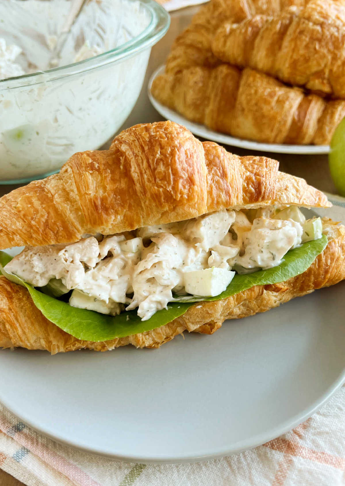 lemon chicken salad in creamy dressing in a croissant roll
