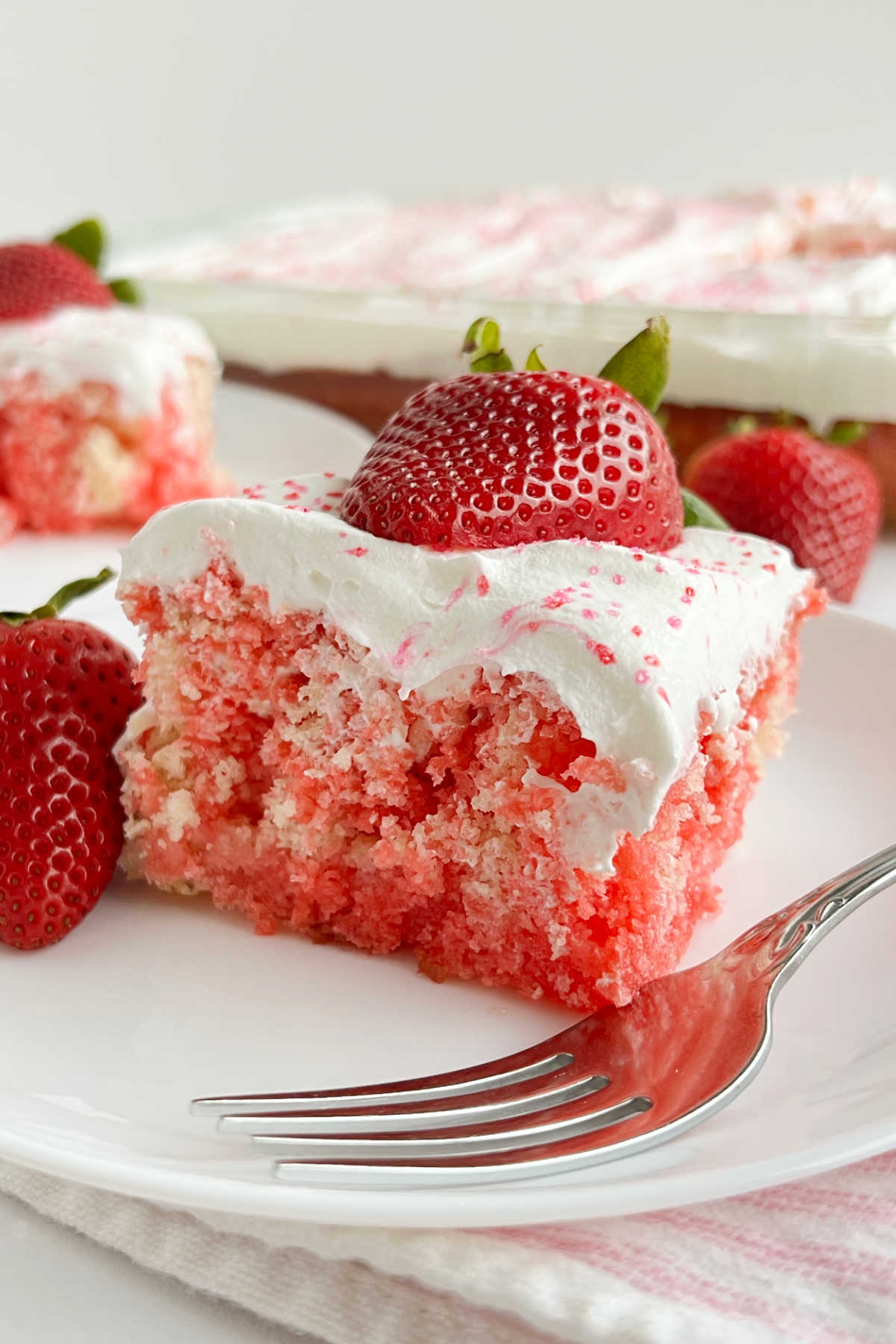 strawberry jello poke cake recipe with cool whip and fresh strawberries