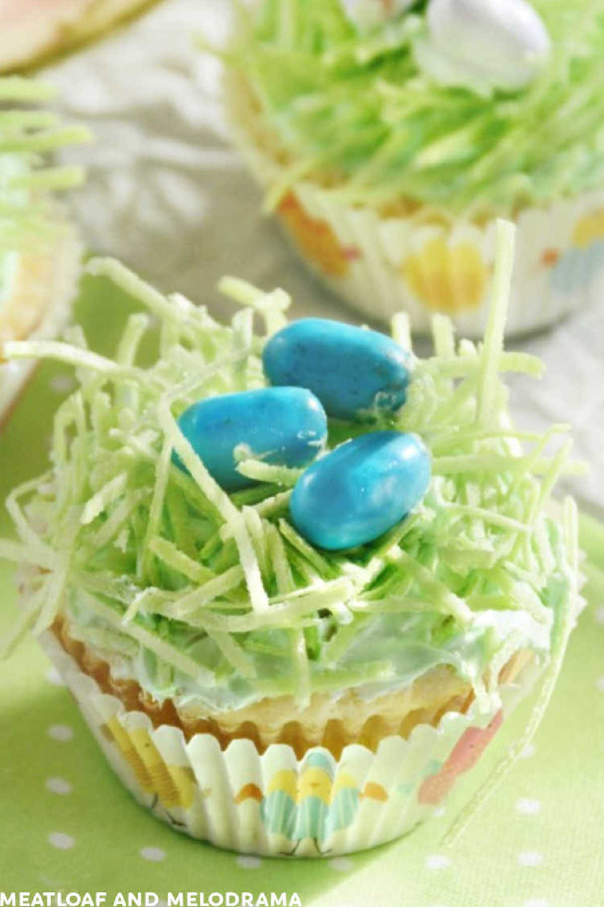 bird's nest Easter cupcakes with edible Easter grass and chocolate mini eggs on the table