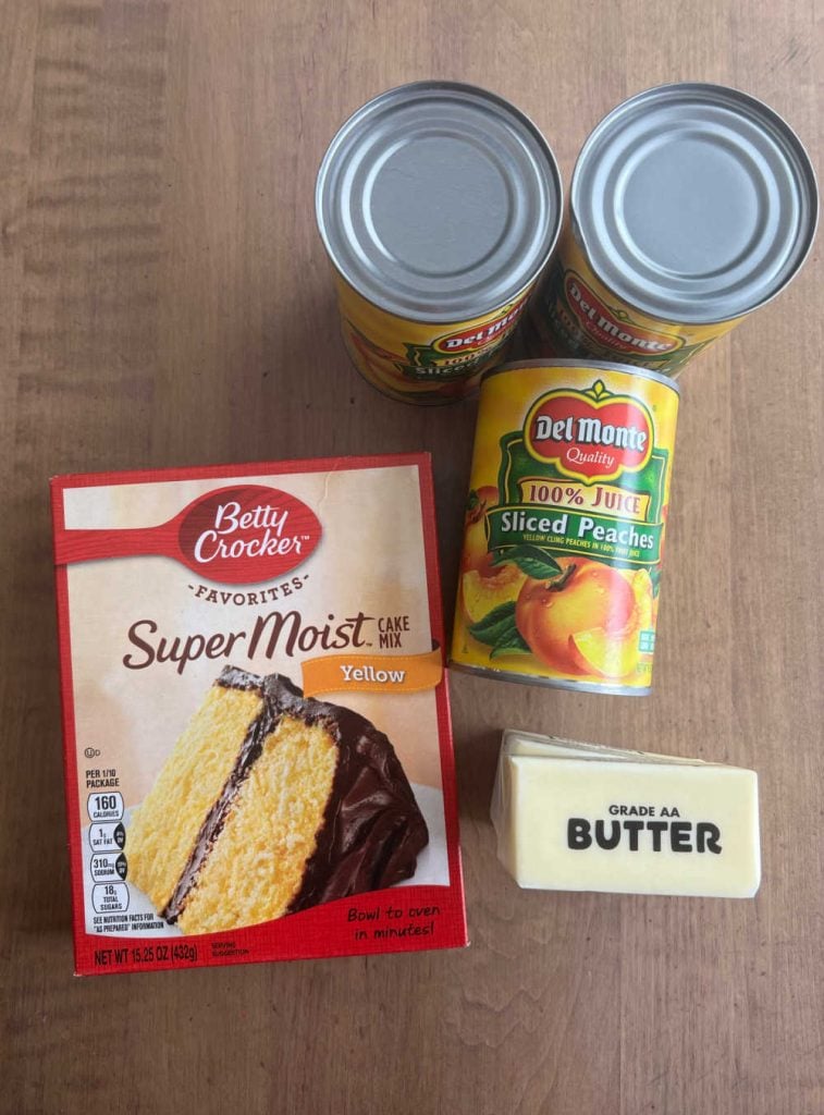 box of yellow cake mix, canned peaches and stick of butter