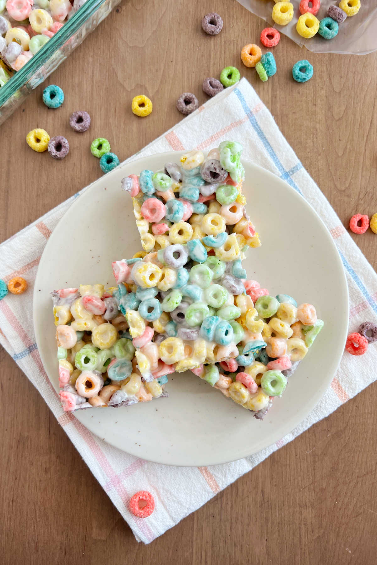 froot loop bars cereal treats made with Froot Loops cereal and marshmallows on a plate