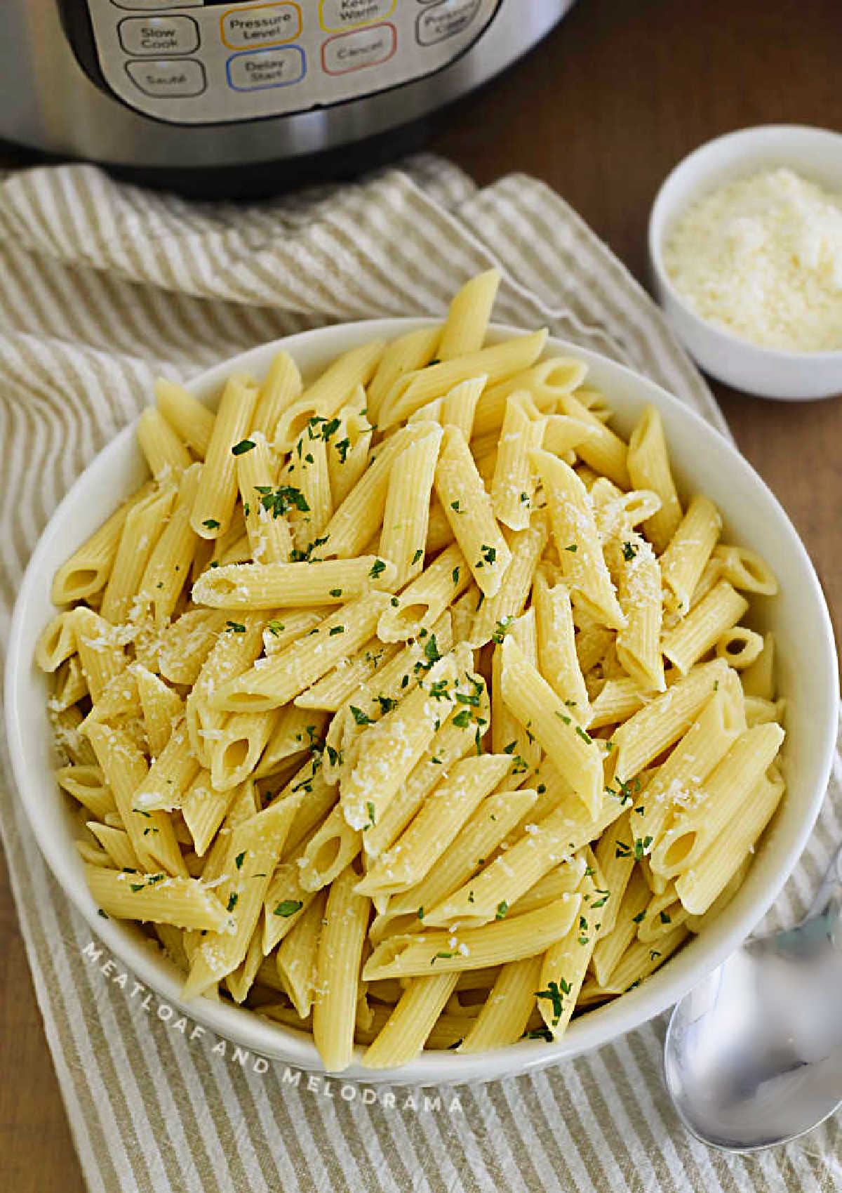 bowl of penne pasta with Parmsean cooked in the instant pot pressure cooker