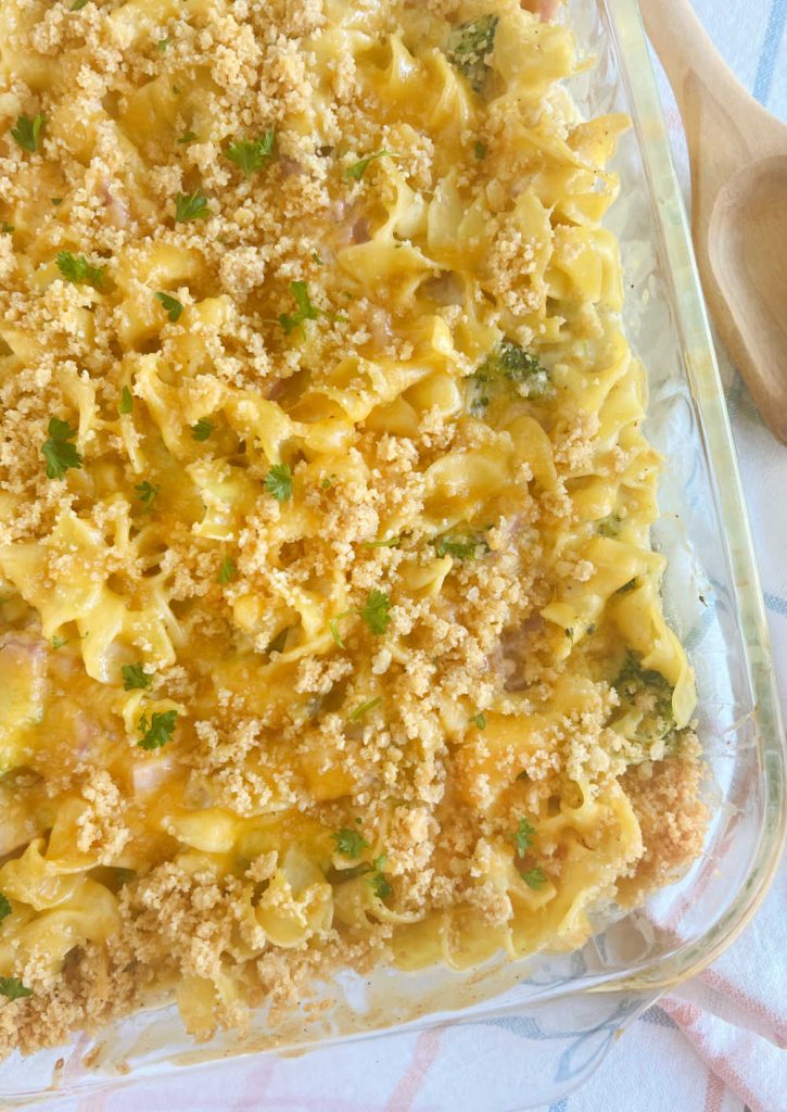 baked ham and cheese casserole with toasted bread crumbs in baking dish