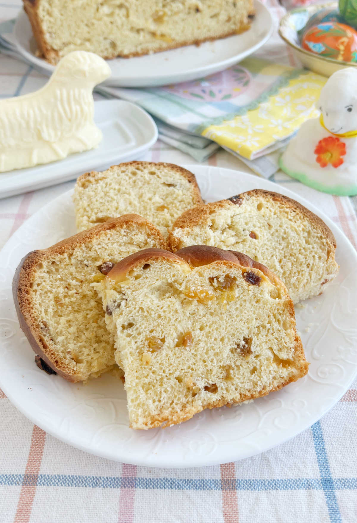 slices of Slovak Easter bread with raisins and butter lamb on table