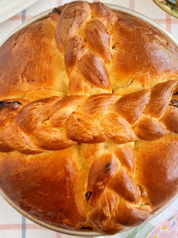 Slovak Easter Paska bread with golden raisins and braided cross in on table