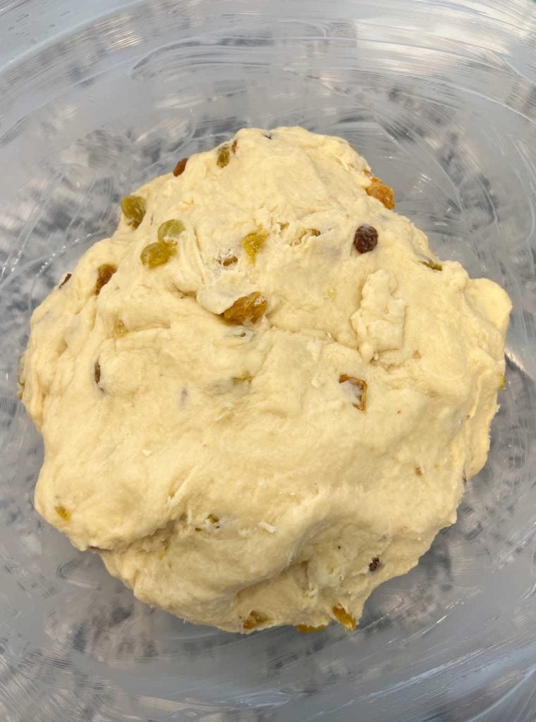 paska dough with golden raisins in large mixing bowl