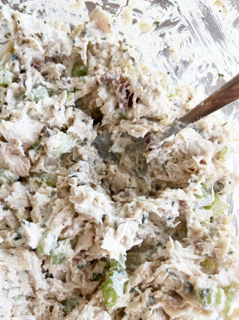 mix chicken with salad ingredients in large bowl