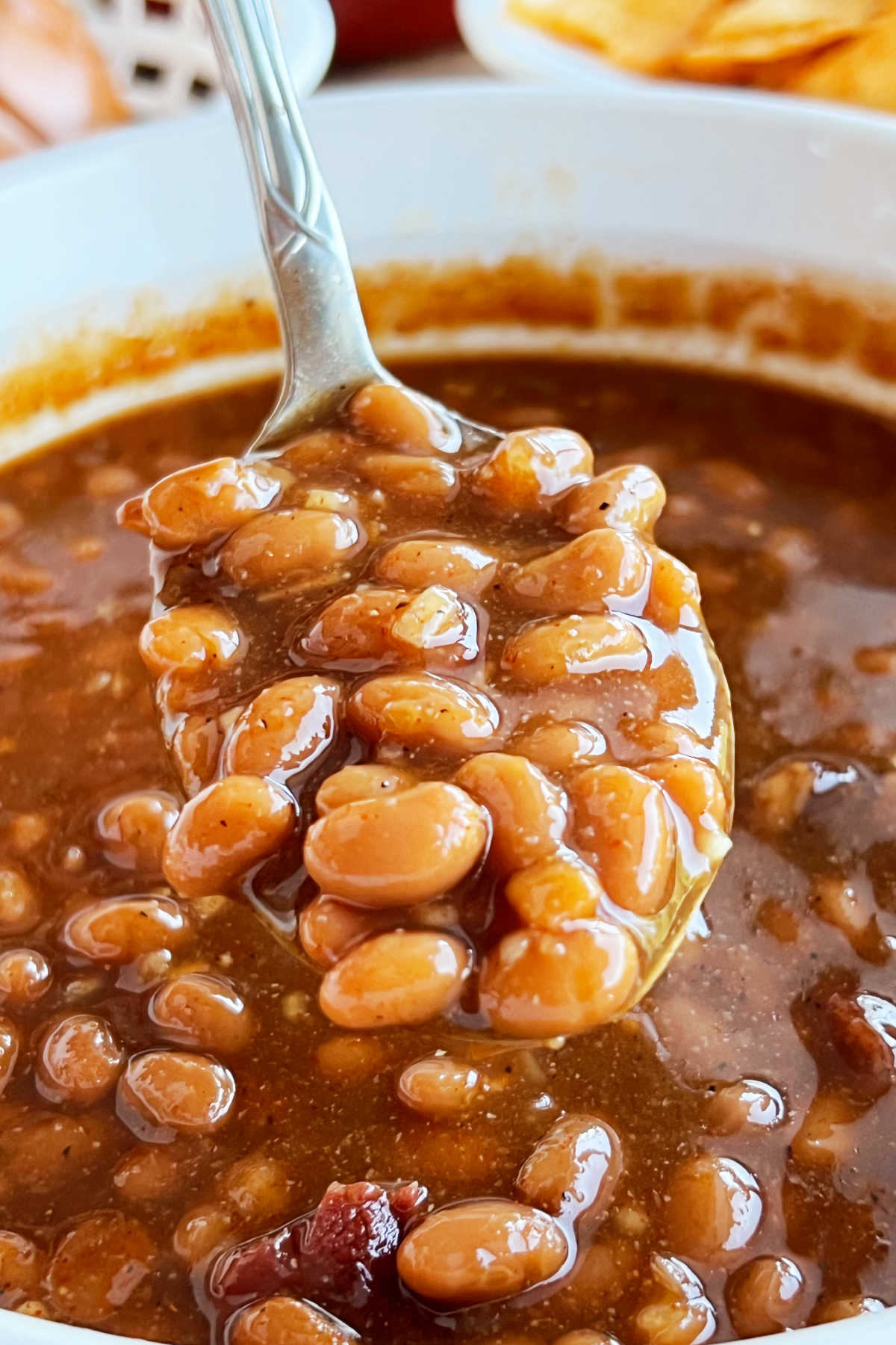 easy brown sugar baked beans on a serving spoon