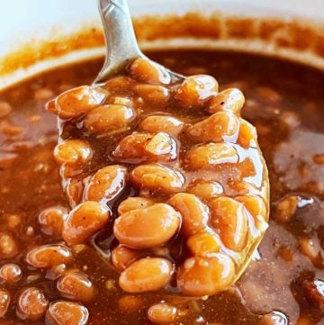 easy baked beans with brown sugar on a serving spoon