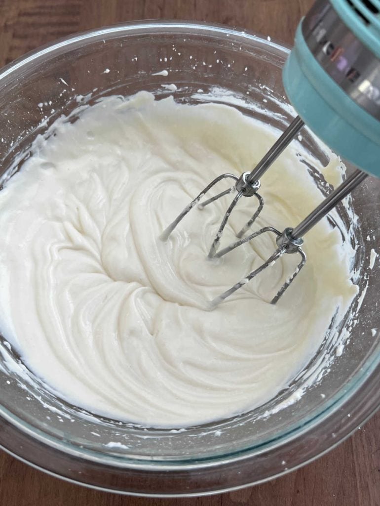 ricotta cheese and cream cheese in mixing bowl