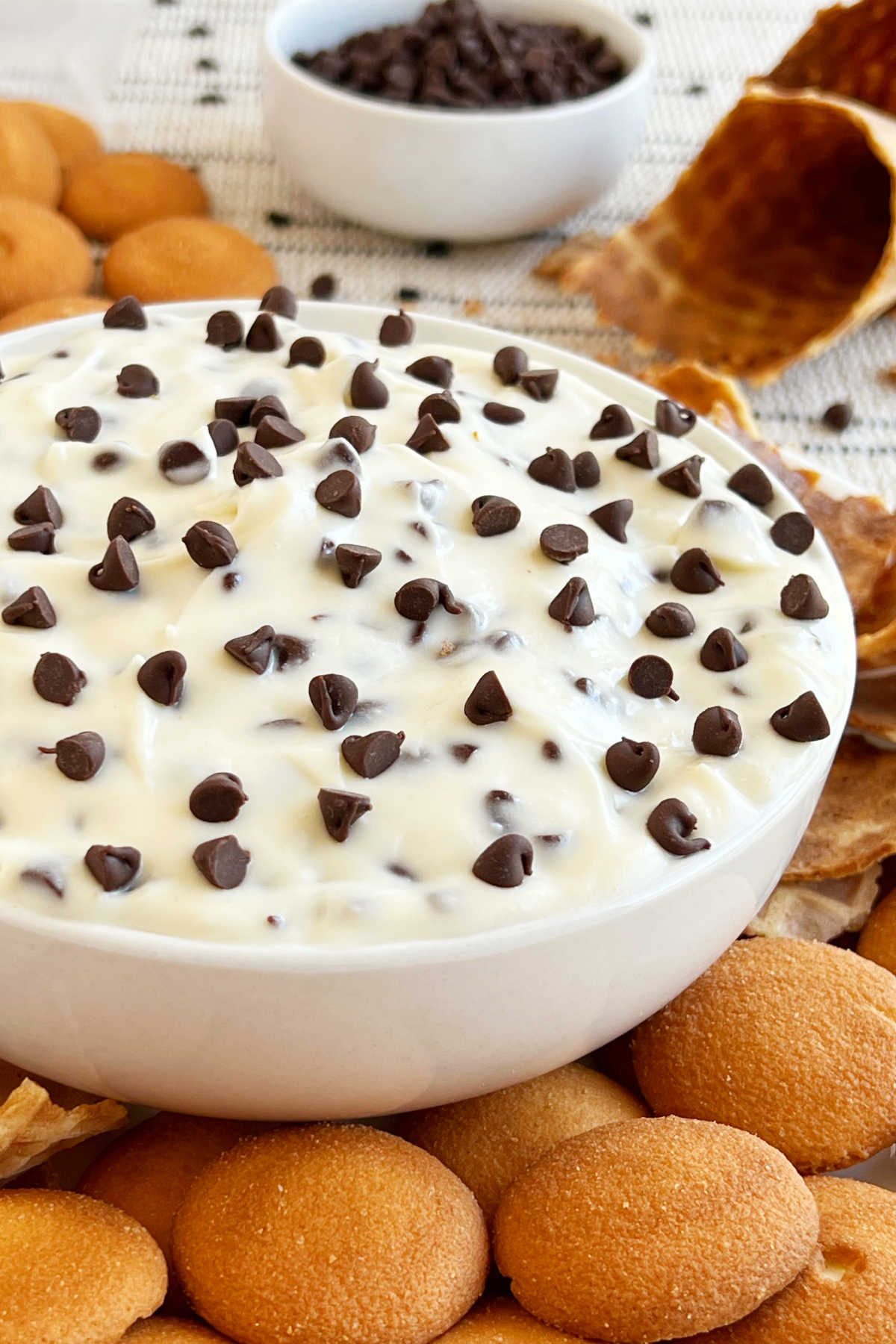 easy cannoli dip with cream cheese and mini chocolate chips and dippers