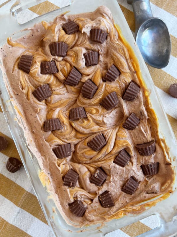 homemade chocolate peanut butter ice cream with mini reese's cups in loaf pan