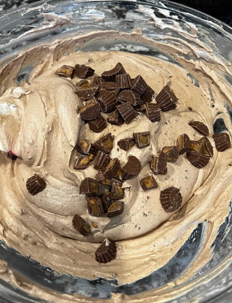 fold reese's candy into whipped cream mixture