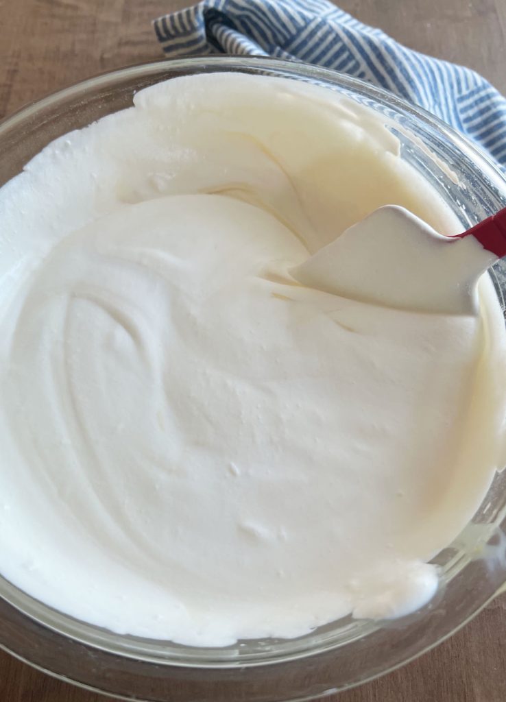fold whipped cream into sweetened condensed milk in large mixing bowl