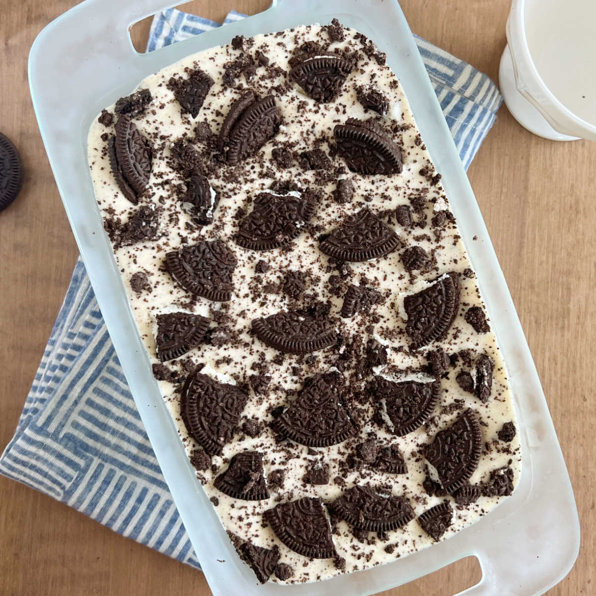 3 ingredient oreo ice cream with oreo cookies on top in bread pan