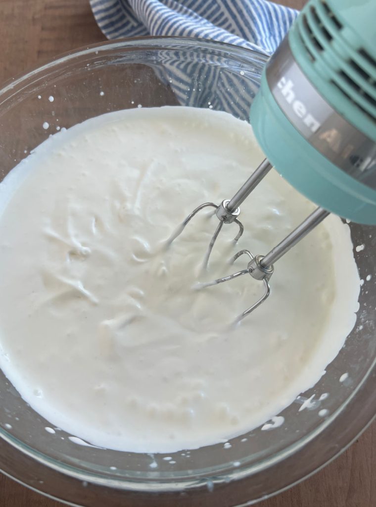 heavy whipping cream in large bowl with electric mixer