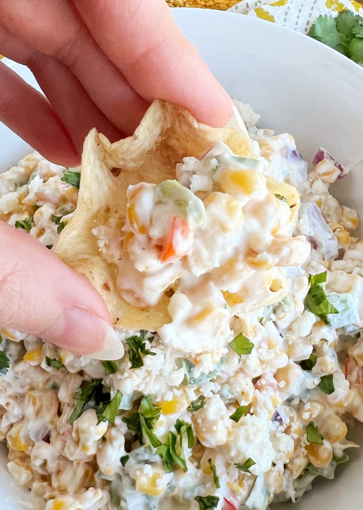 Mexican street corn dip in Tostitos chip