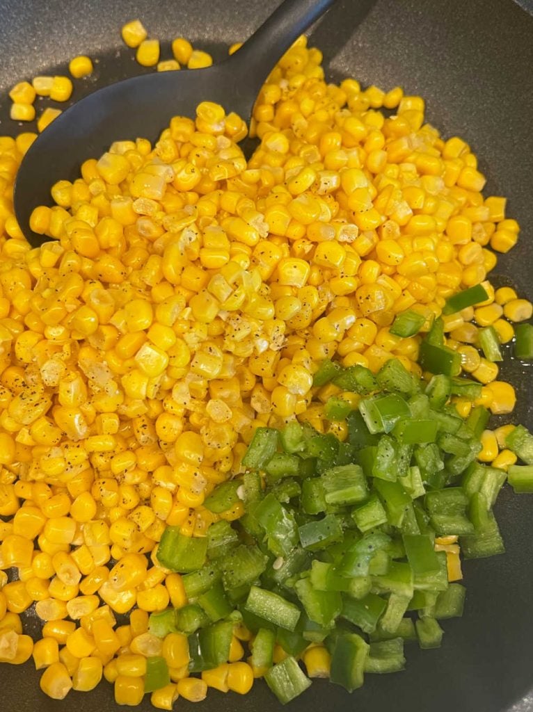 roast canned corn in skillet with chopped peppers
