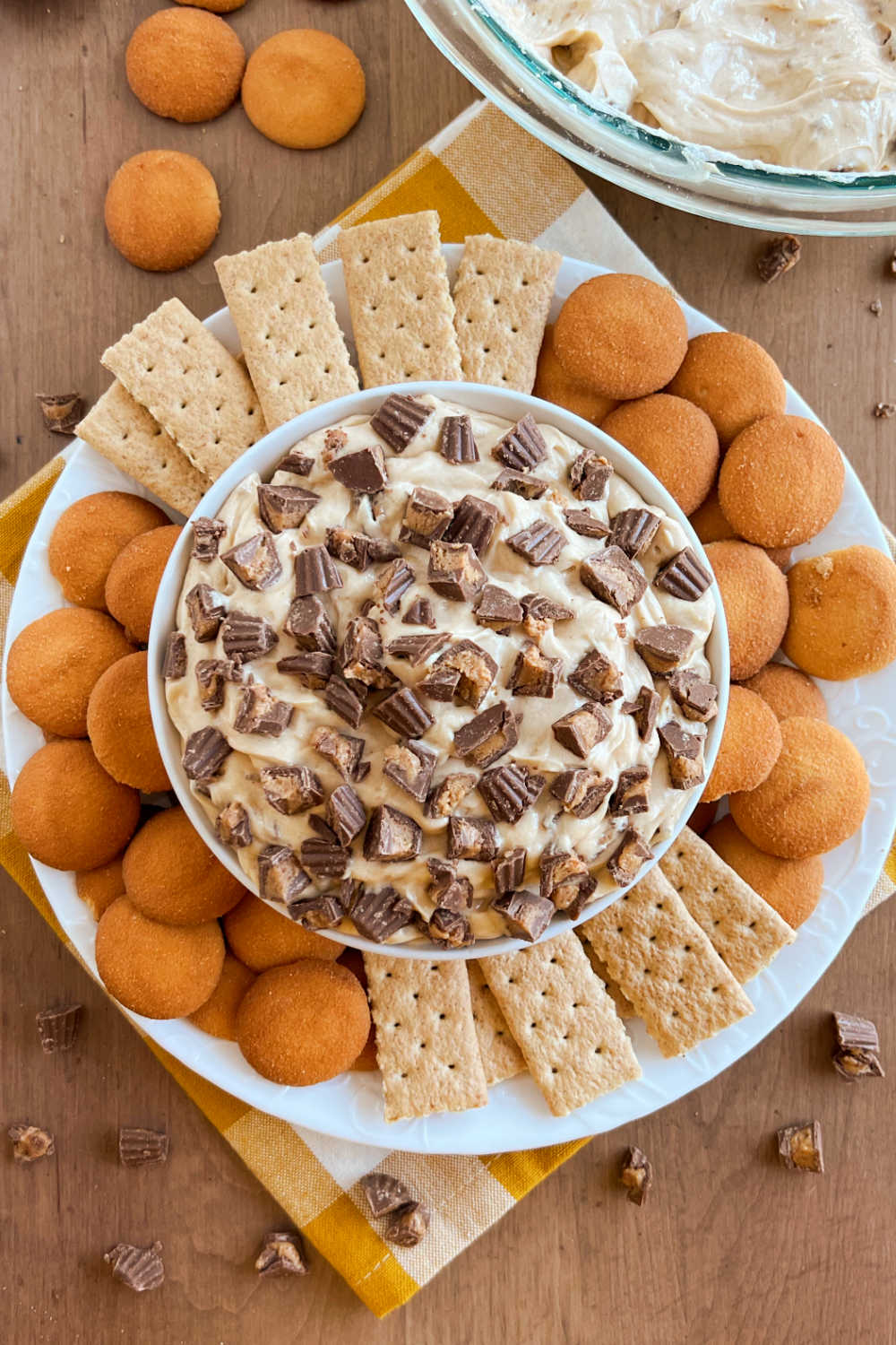 Reese's peanut butter cheesecake dessert dip on platter with dippers