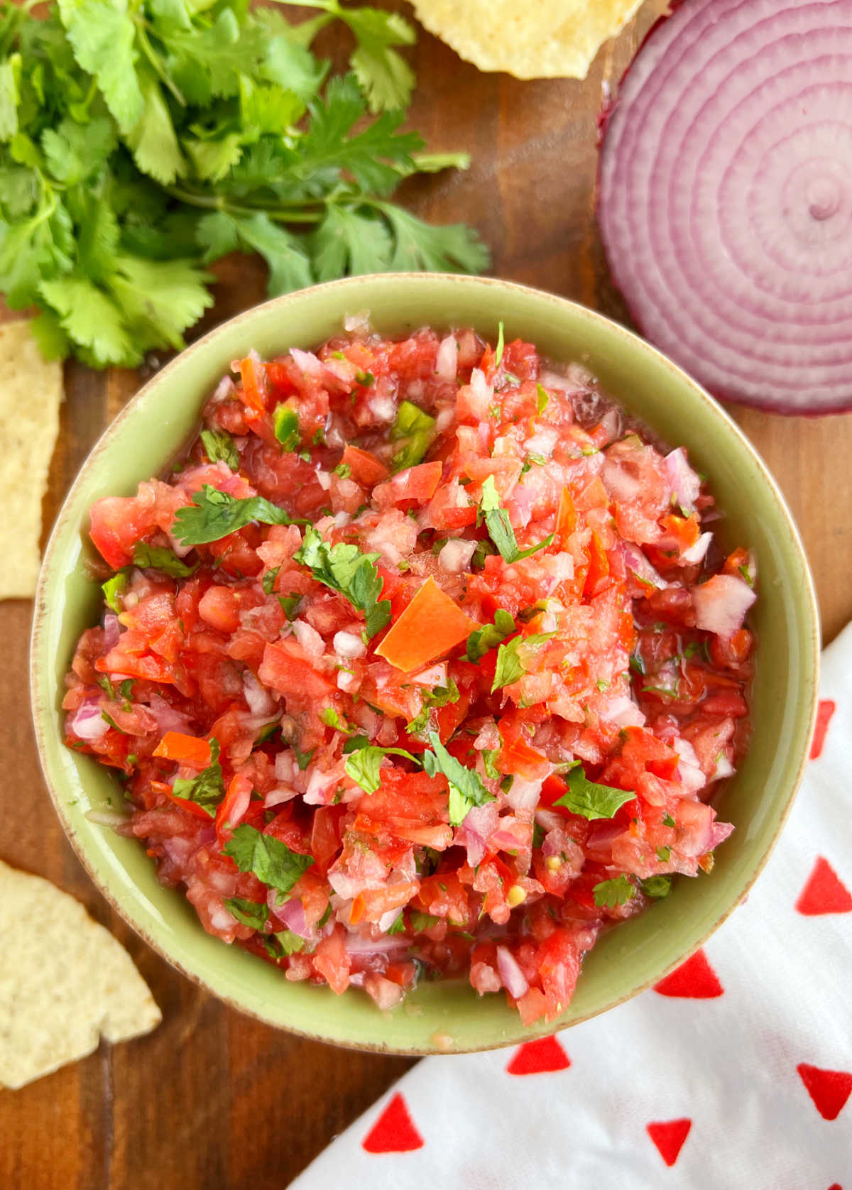 bowl of authentic pico de gallo with red onion and tortilla chips