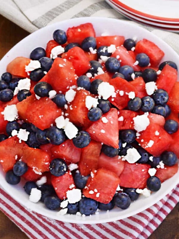 watermelon feta blueberry salad in a white bowl on the table.