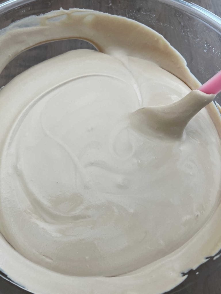 fold whipped cream mixture into sweetened condensed milk with spatula