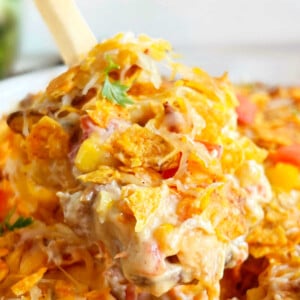 cheesy Dorito chicken casserole on a wooden spoon