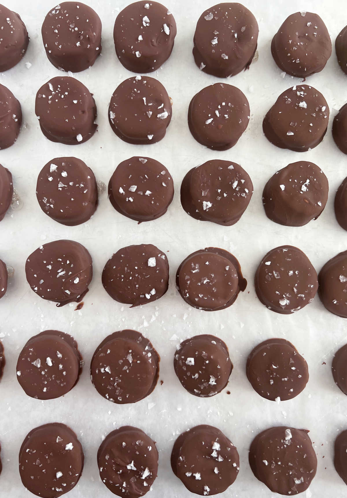 frozen banana bites on parchment paper-lined baking sheet