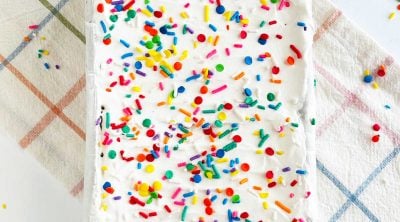 ice cream sandwich cake with sprinkles in loaf pan