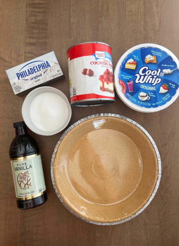 cream cheese, sugar, cherry pie filling, cool whip, graham cracker crust, vanilla