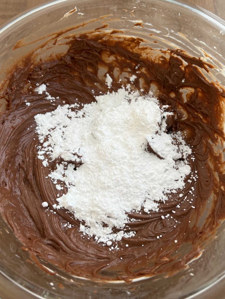 nutella cream cheese and powdered sugar in mixing bowl