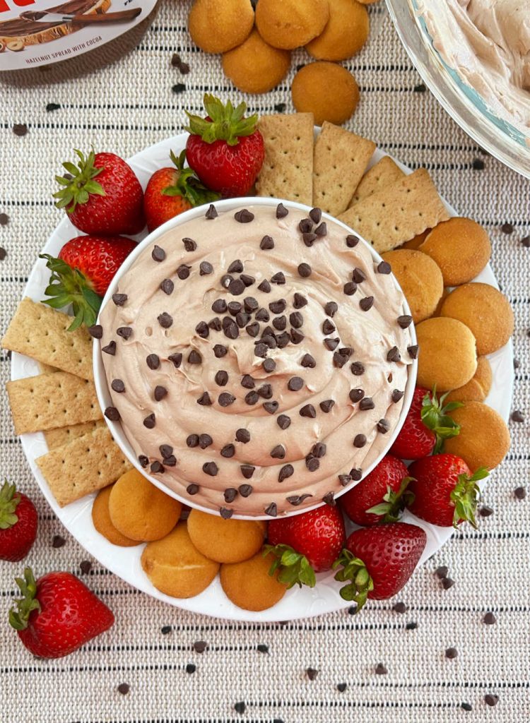 Nutella dip with chocolate chips on platter with dippers