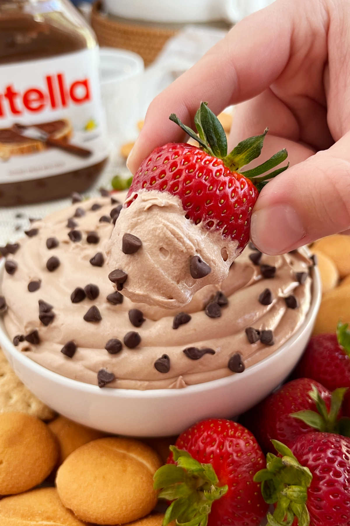 dip strawberry into nutella cheesecake dip.