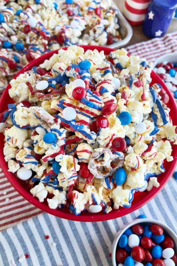 patriotic popcorn with red white and blue candy and ribbons on 4th of July table