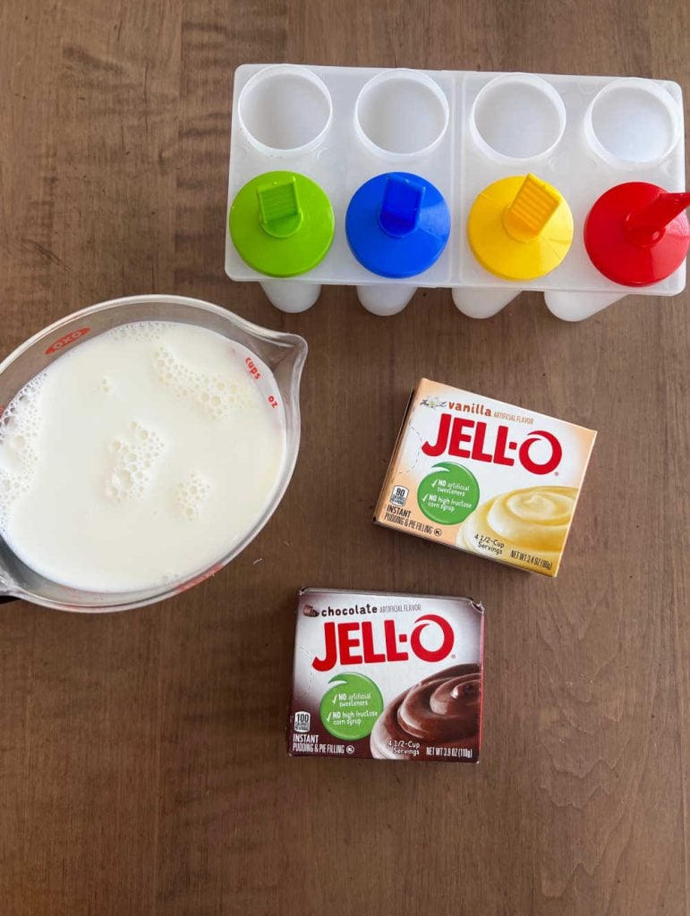 Jello instant vanilla pudding mix, instant chocolate pudding mix, milk and popsicle molds