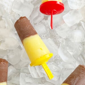homemade pudding pops with vanilla and chocolate pudding over ice.