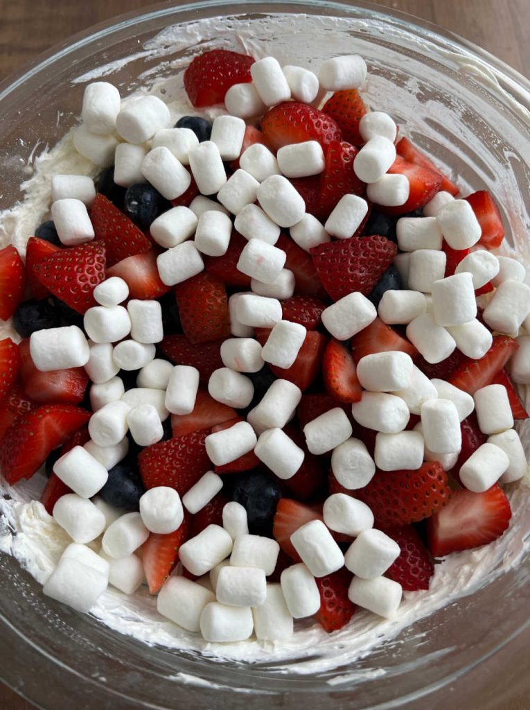 fresh berries and mini marshmallows in cream cheese mixture