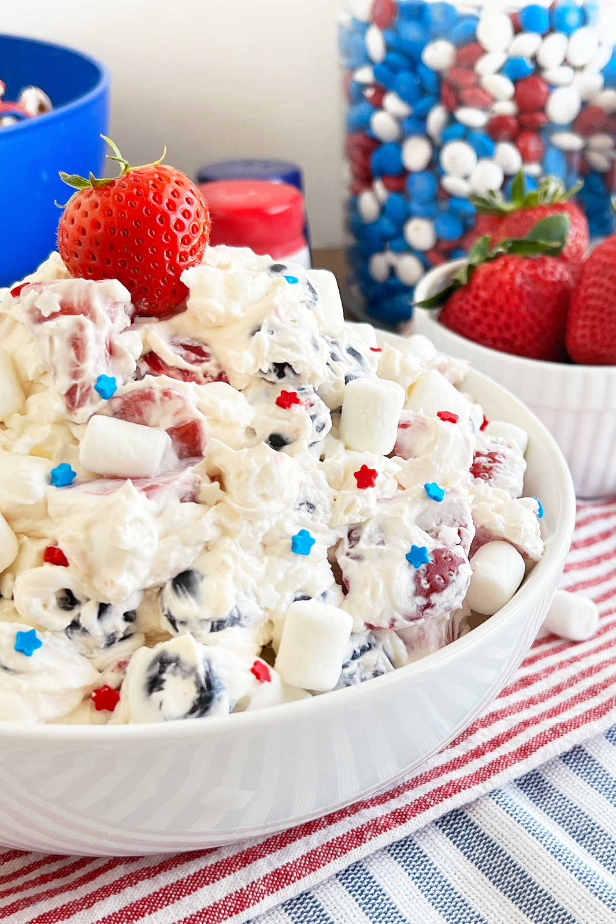 red white and blue cheesecake salad with mini marshmallows on 4th of July table