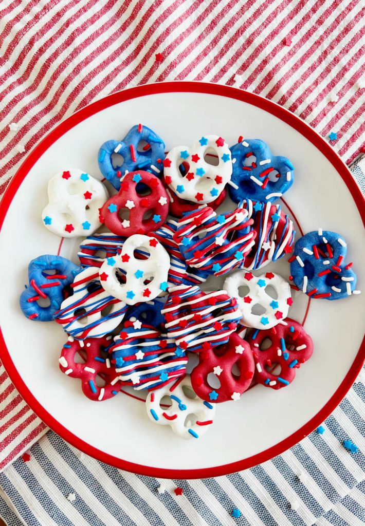 patriotic pretzels with star sprinkles on fourth of july table.