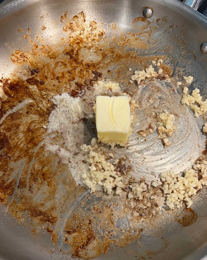 cook butter and minced garlic in skillet
