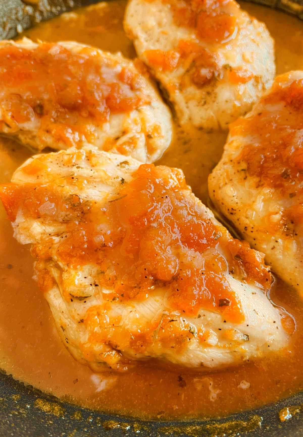 glazed apricot chicken with apricot preserves in skillet