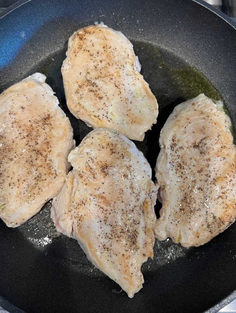 cook chicken breast halves in skillet