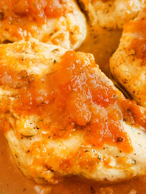glazed apricot chicken with apricot preserves in skillet