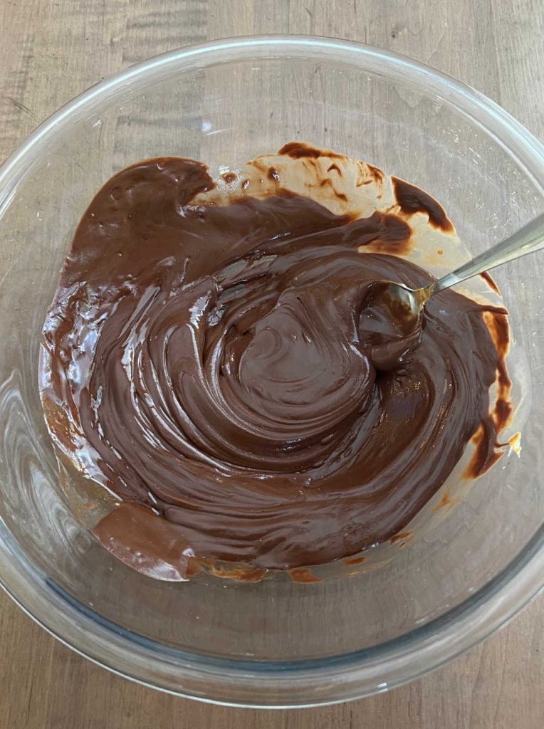 melt semi sweet chocolate chips, butter and peanut butter in large mixing bowl.