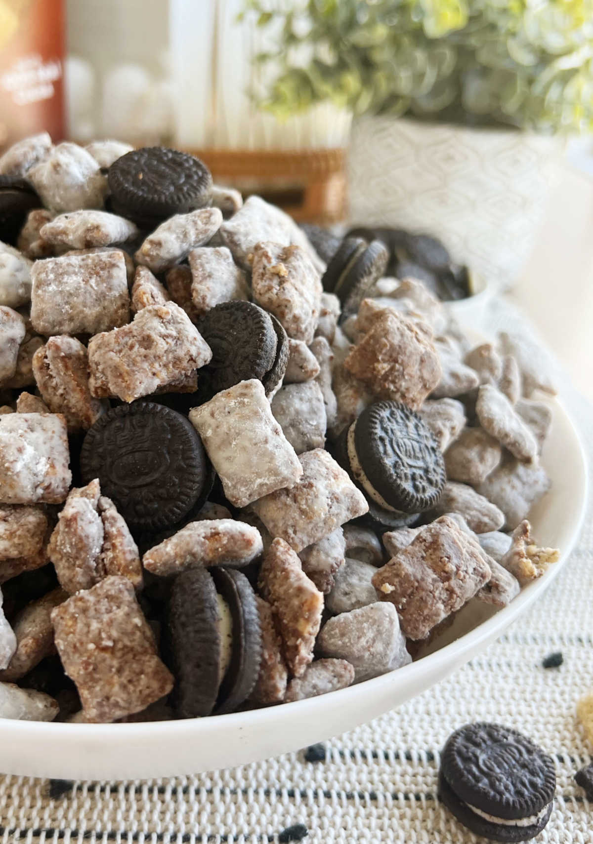 bowl of Oreo puppy chow (muddy buddies) with Oreo cookies.