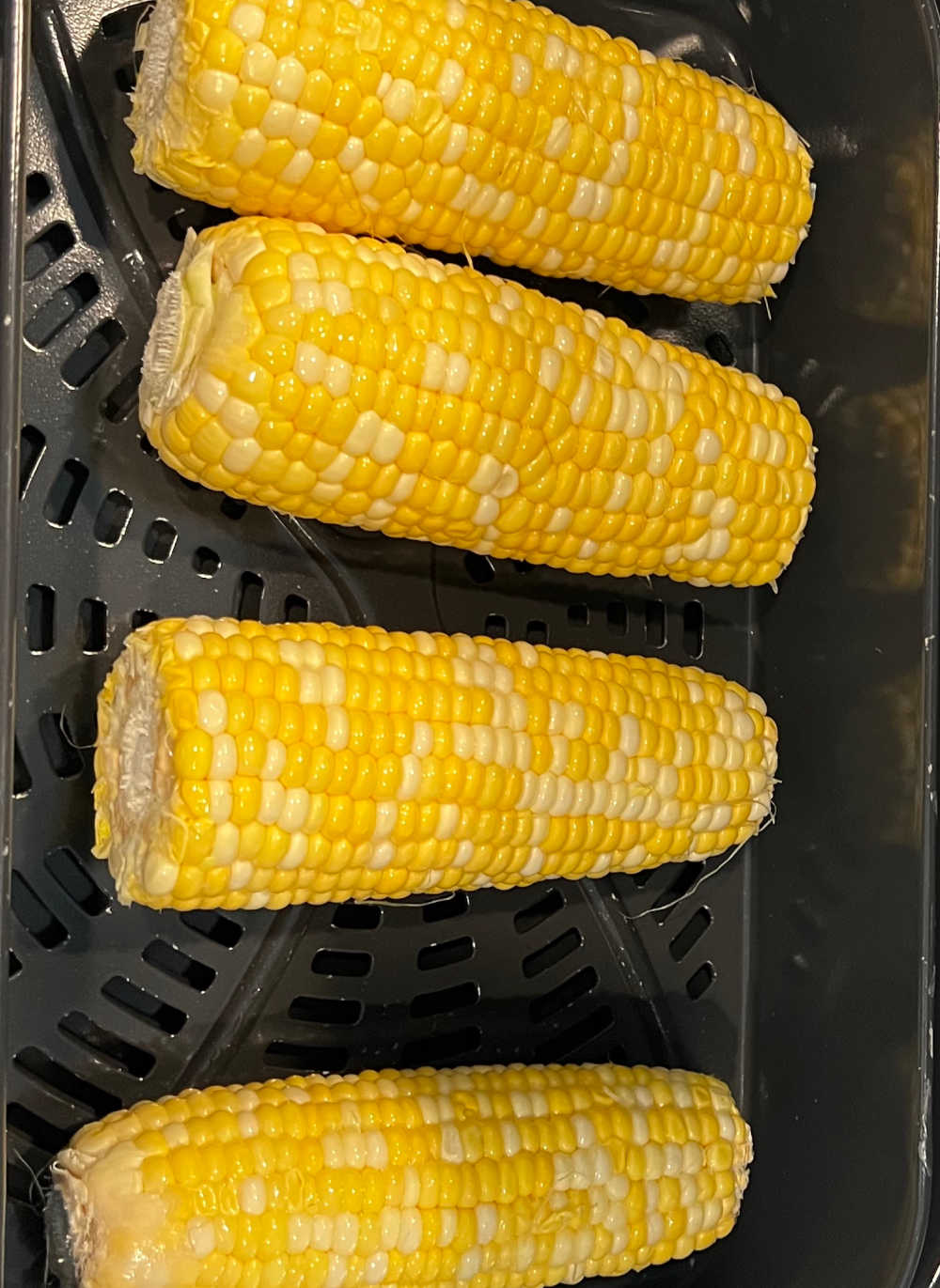 cook fresh ears of corn in air fryer basket.
